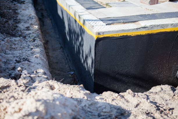 Professional Basement Waterproofing technician working in Vickery, OH